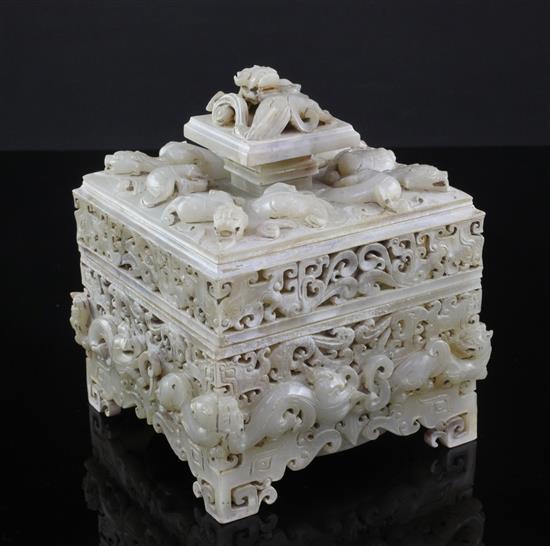 A Chinese archaistic burnt white and russet jade seal box and cover, width 12cm, height 14cm, wood stand